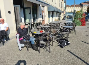 Person enjoying a coffee at a cafe